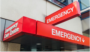 Red emergency room sign at hospital entrance