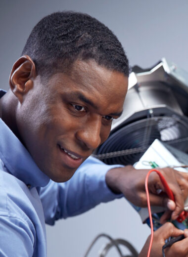 Dedicated technician repairing medical equipment to ensure optimal performance and patient safety.