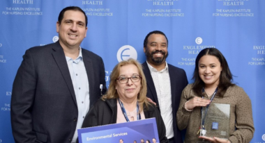 Crothall Healthcare executives pose with award at the Kaplan Institute for Nursing Excellence event.